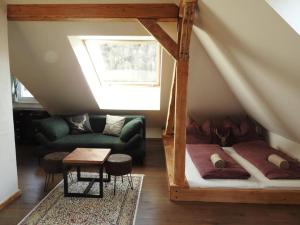 a living room with a loft bed and a couch at Ferienhaus "Platzhirsch" in Hollenstein an der Ybbs