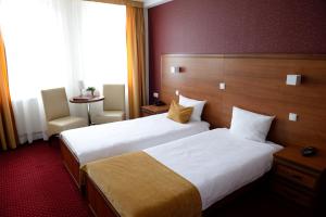 A bed or beds in a room at QUEST HOTEL - dawniej Hotel Planeta