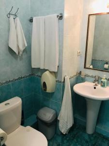 Um banheiro em Атриум гостевой дом