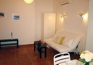 a living room with a couch and a table at Apartments Issa in Makarska
