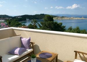 a balcony with a view of the water at Apartments Issa in Makarska
