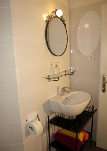a bathroom with a sink and a mirror at Apartments Issa in Makarska +65 photos
