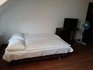 Säng eller sängar i ett rum på Vila Vanda