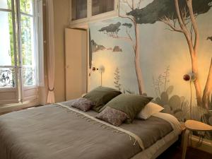 Säng eller sängar i ett rum på Le Transvaal-Maison d'Hôtes