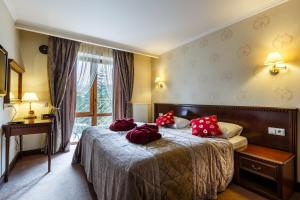 Кровать или кровати в номере Romantik SPA Hotel