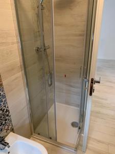 a shower in a bathroom with a toilet and a sink at Casa Celeste in San Benedetto del Tronto