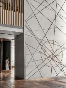 a wall mural with a geometric design on it at CHAO Sanlitun Beijing in Beijing