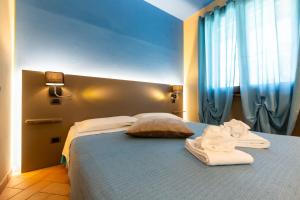 Agriturismo AgrileisureTime客房内的一张或多张床位