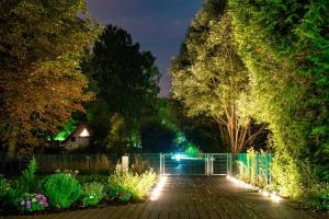 a garden at night with lights at Bienenhaus in Sassnitz