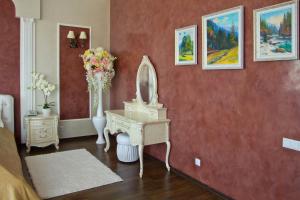 a living room with a painting on the wall at Sobkoff in Khmelnytskyi