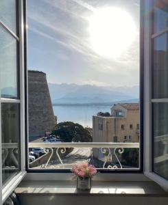 a window with a view of a city at Hotel Belvedere in Calvi