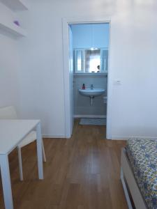 A bed or beds in a room at alloggio verona est S. Pietro