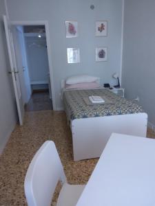 A bed or beds in a room at alloggio verona est S. Pietro