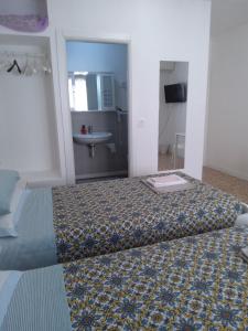 A bed or beds in a room at alloggio verona est S. Pietro