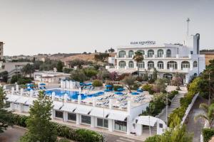an aerial view of a resort with a pool at Club Azzurro Hotel & Resort in Porto Cesareo