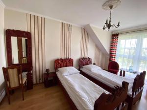 Cama o camas de una habitación en Ustronie Leśne