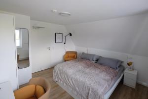 Postel nebo postele na pokoji v ubytování lütte Heidepension + 11 fotografií