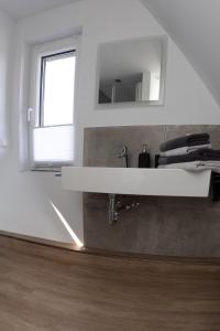 Kuchyň nebo kuchyňský kout v ubytování lütte Heidepension