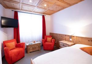 Voodi või voodid majutusasutuse Hotel Engiadina toas