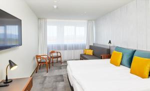 Postel nebo postele na pokoji v ubytování Fosshotel Stykkisholmur + 37 fotografií