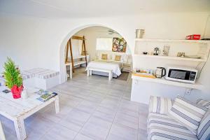 a living room with a couch and a table at 57 on Vermont in Hermanus