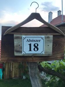 a wooden sign with aasspect on it at 100 Bárányos in Szalafő