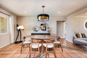 a dining room with a table and chairs at @ Marbella Lane - The Moon Designer Home right behind the JTNP in Joshua Tree