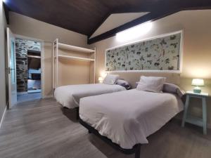 Кровать или кровати в номере Apartamentos rurales Casa Gorrión - Mazaricos