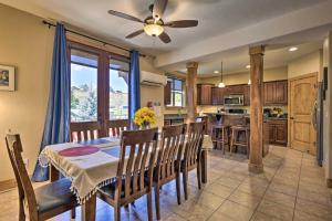 a kitchen and dining room with a table and chairs at Condo with Mtn Views Less Than 1 Mi to Pagosa Hot Springs! in Pagosa Springs