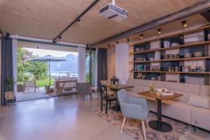 a living room with a couch and a table at Balthasar Volcano Apartments - Adults only in St. Wolfgang +53 photos
