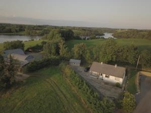 an aerial view of a house and a river at Innishmore Island Farmhouse in Cavan