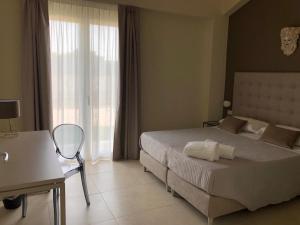 Posteľ alebo postele v izbe v ubytovaní Villa Iiulia Hills