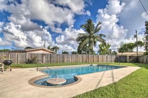 a swimming pool in a yard with a fence at Pet-Friendly Margate House with Private Pool! in Margate