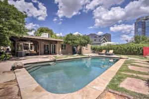 a swimming pool in the backyard of a house at Phoenix Getaway with Private Pool and Grass Yard! in Phoenix