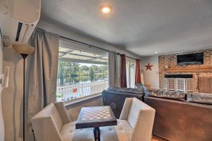 a living room with a couch and a table at The Grey Goose Waterfront Home with Beach in New Bern
