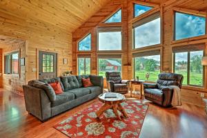 a living room with a couch and two chairs and a table at Woodsy Pinetop Oasis, 11 Mi to Rainbow Lake! in Pinetop-Lakeside