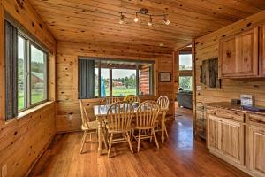 a dining room with a table and chairs at Woodsy Pinetop Oasis, 11 Mi to Rainbow Lake! in Pinetop-Lakeside