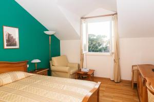 Postel nebo postele na pokoji v ubytování Hotel Spongiola + 37 fotografií