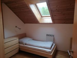 A bed or beds in a room at Appartement Moni / Golf & Ski - TOP 9