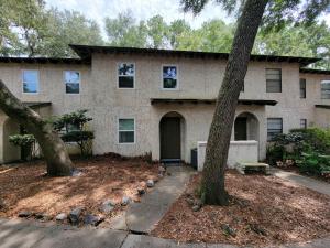 a house with a tree in front of it at HHI Homes- Newly Renovated Cozy Modern Pet-Friendly Villa-Ideal Location in Hilton Head Island