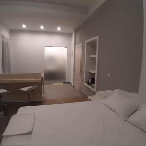 A bed or beds in a room at Dimitra apartments koroni