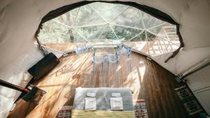 an inside view of a tent with a table and chairs at Wine Space in Ambrolauri