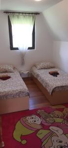 Voodi või voodid majutusasutuse TARA Vila Rajak toas