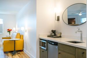 a kitchen with a sink and a mirror at The Inn on Pine in Calistoga