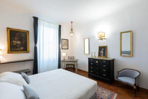En eller flere senge i et værelse på Fiesole's cozy Apartment 2