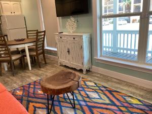 a living room with a table and a coffee table sidx sidx sidx at South Padre Island Beach House Retreat Downstairs in South Padre Island