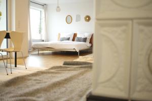 Ένα ή περισσότερα κρεβάτια σε δωμάτιο στο zuHause mit Berg-und BodenSeesicht