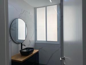 a bathroom with a black sink and a mirror at New! luxus- Best suit 2 minutes fromTel Aviv in Bat Yam +20 photos