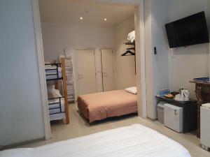 A bed or beds in a room at Albert - Rooms