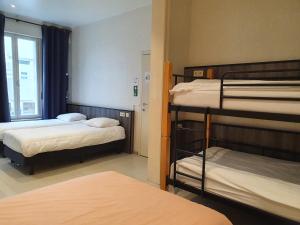 A bed or beds in a room at Albert - Rooms